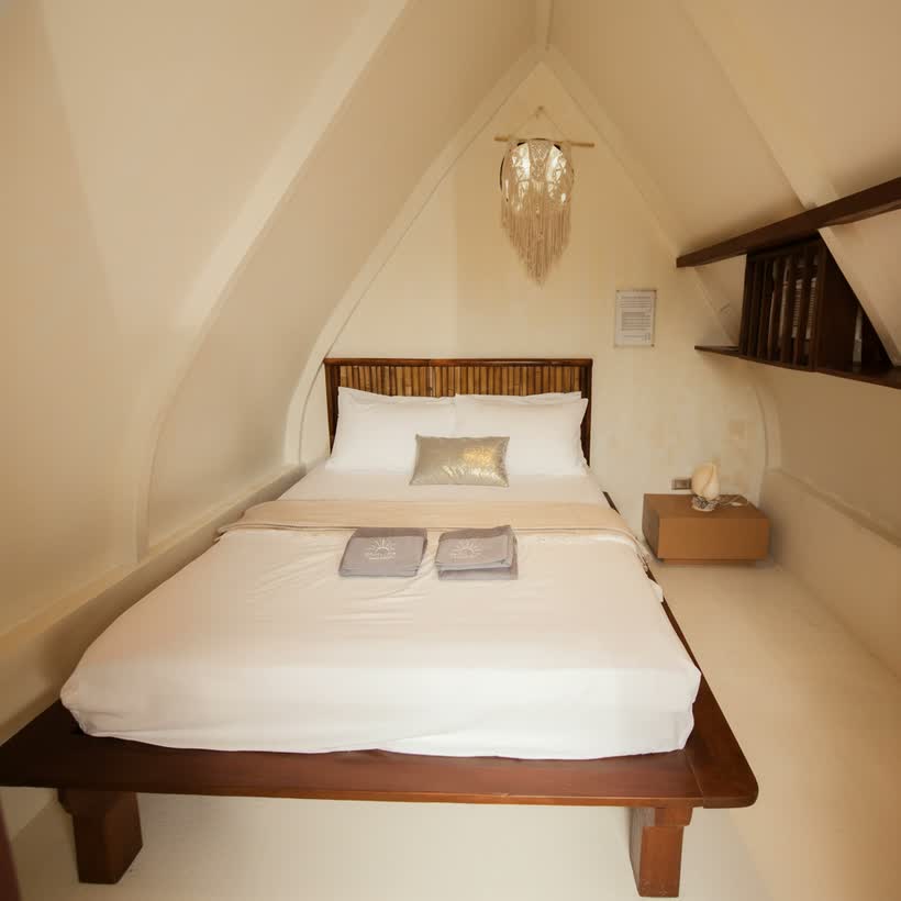 The Gypsea Hut’s queen bed in its snug A-frame