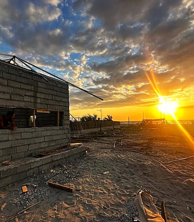 The first block walls going up at sunset